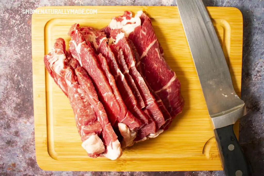 Cut Beef across the grain into thin slices