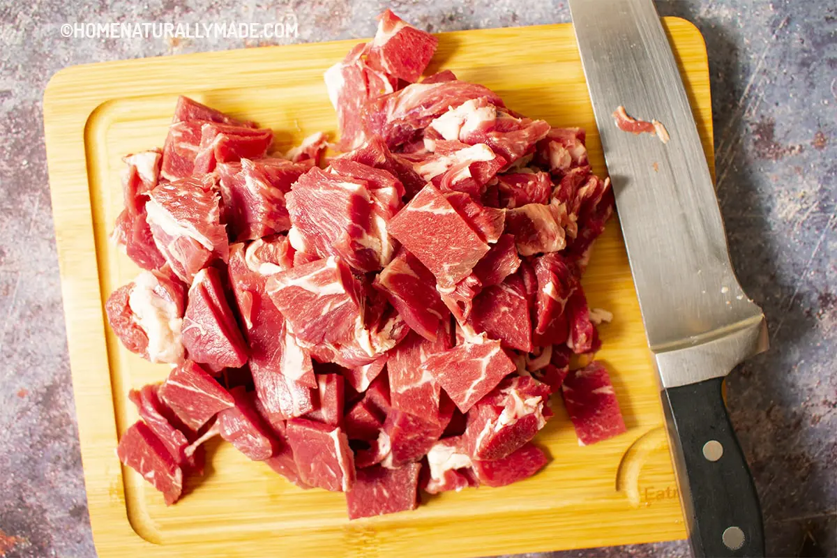 Cut beef into bite size slices to prepare and tenderize beef
