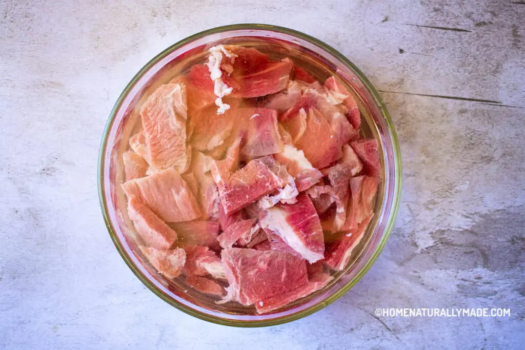 Soak beef in cold water to prepare and tenderize beef