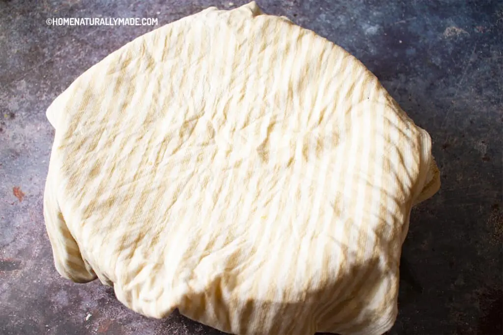Cover the Dough with a Damp Kitchen Towel for better proofing