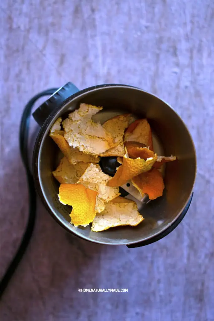 dried mandarin orange peel in a spice grinder
