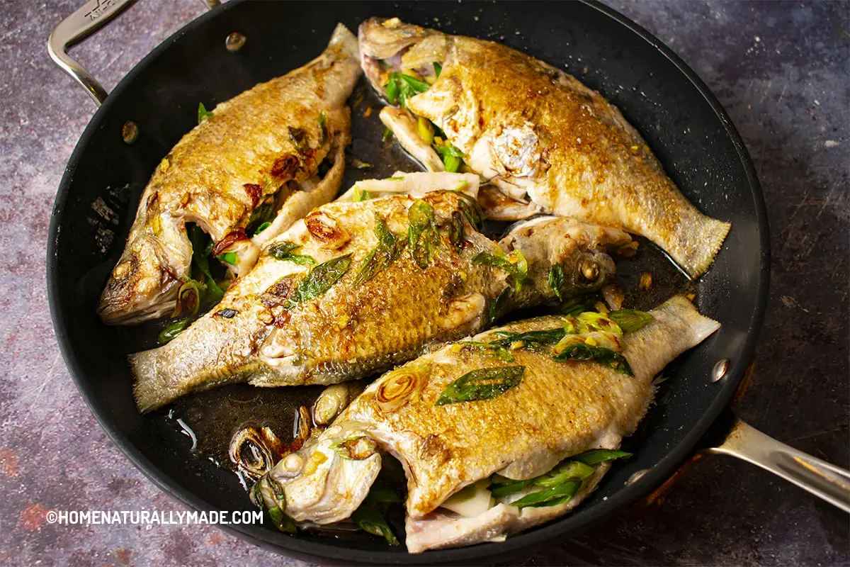 Add Cooking Condiments to Pan Fried Whole Fish