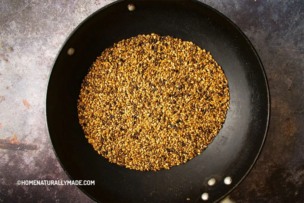 Roasting grains via stovetop using wok