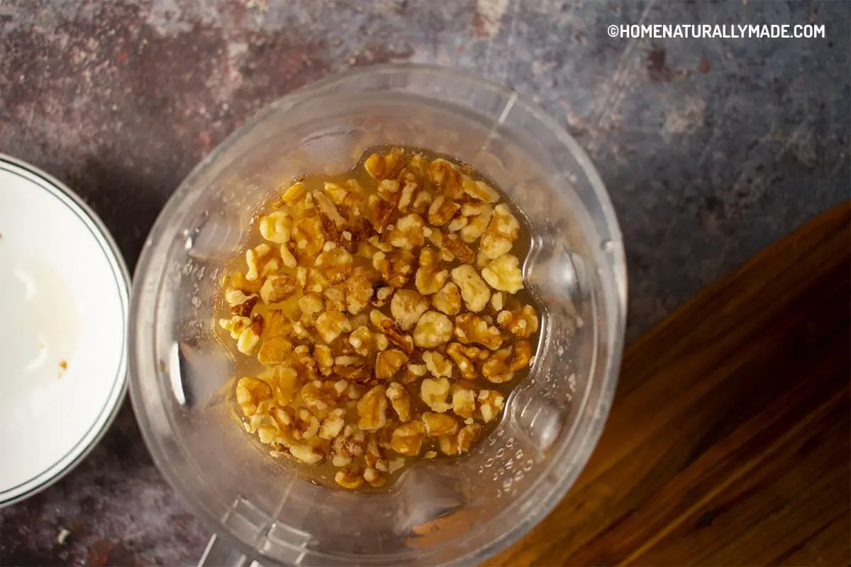 Add walnut and other ingredients to a blender for walnut smoothie