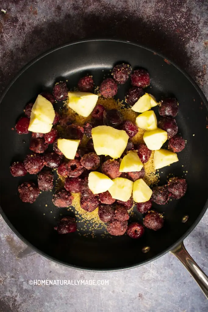 Combine cherry, apple slices and sugar in a fry pan