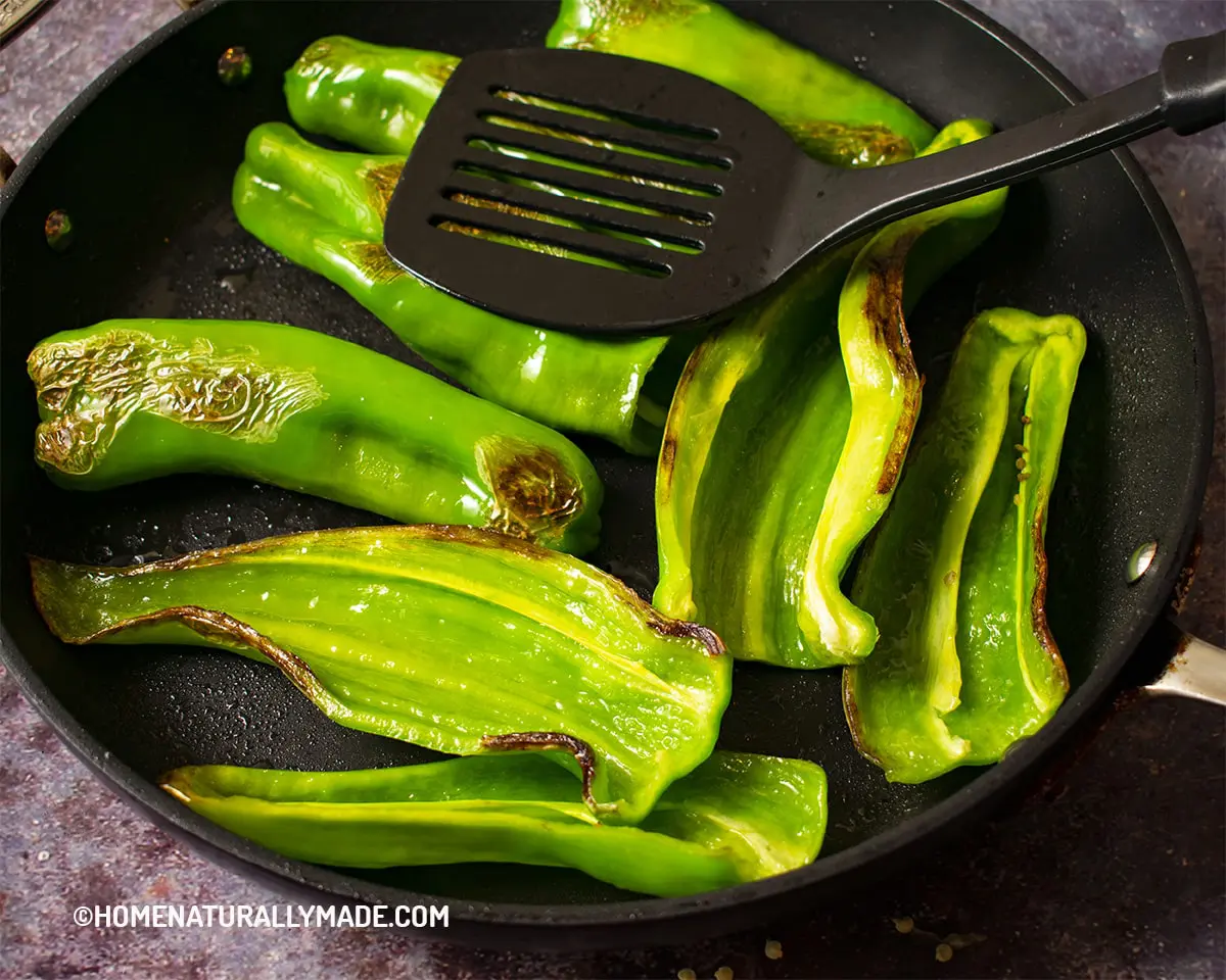 Pan fry long green peppers for Hu Pi Qing Jiao