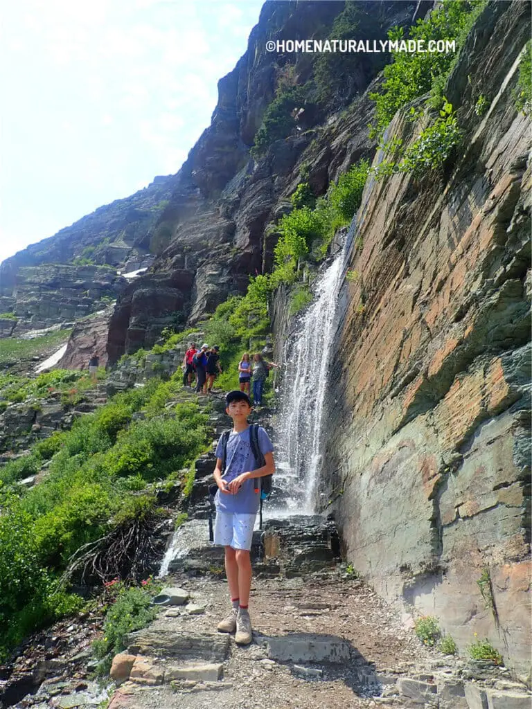 waterfall in the middle of the Grinnell Glacier Trail 