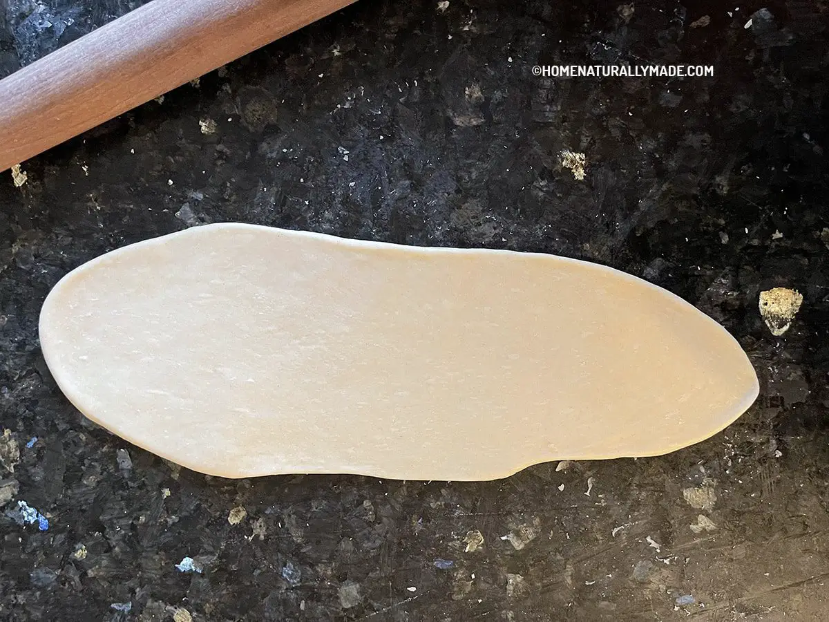 Roll the dough slab into a thin sheet