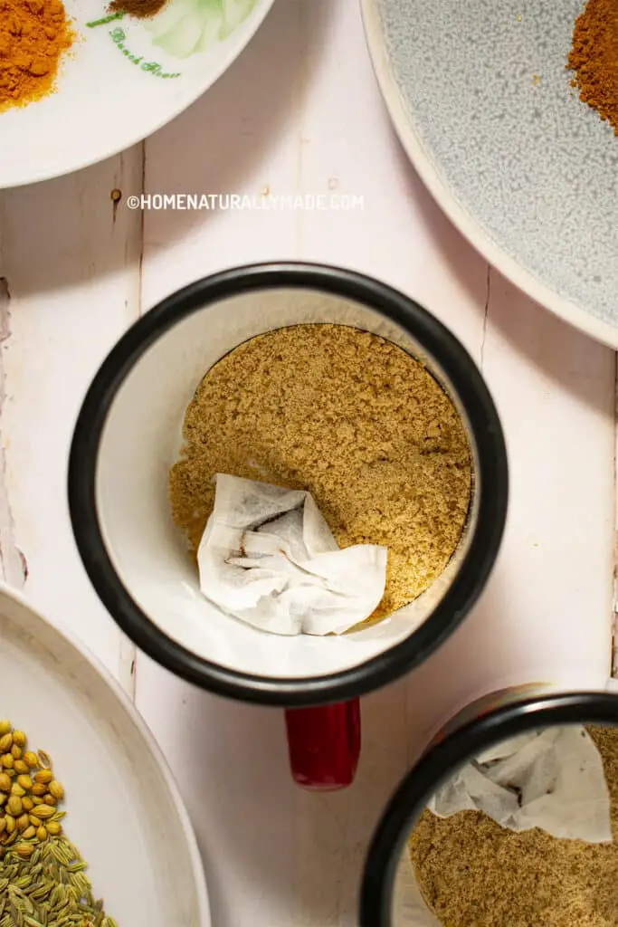 Add homemade Instant Chai Mix and tea bags into a mug