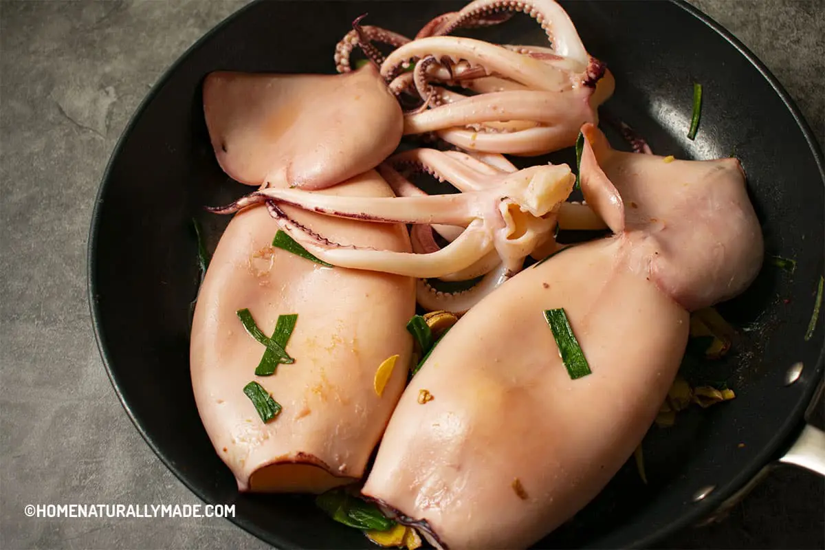 Sear the whole squid in an hard anodized frying pan