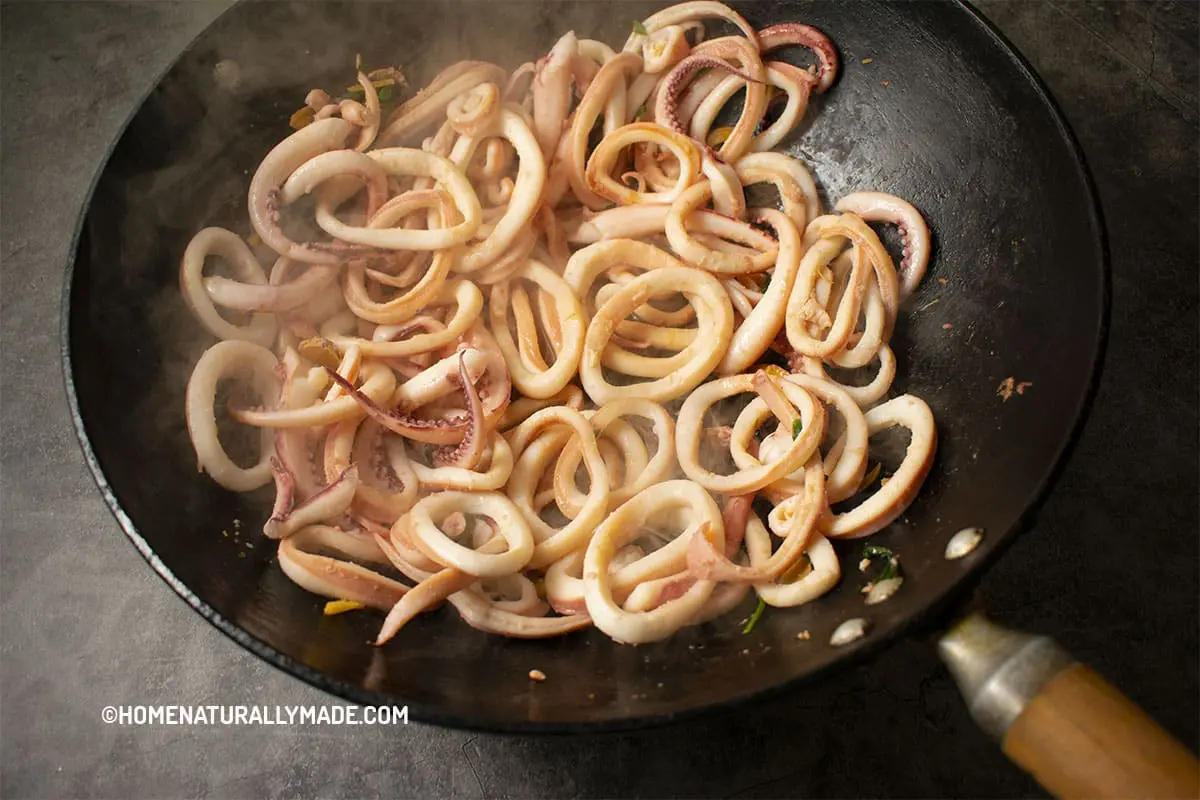 Stir Fry seared & sliced squid in the wok