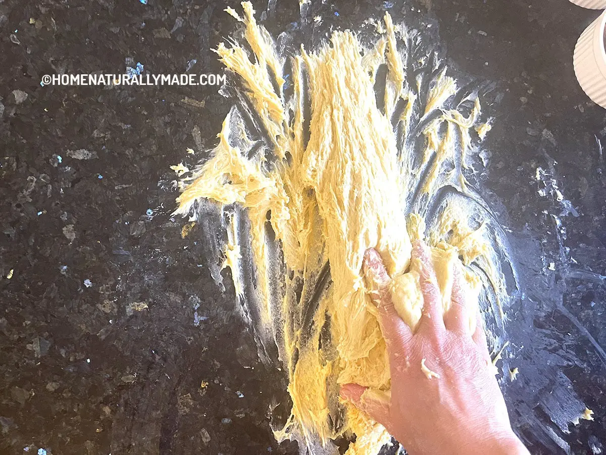 work on the dough on Panettone - slap the dough against a hard surface