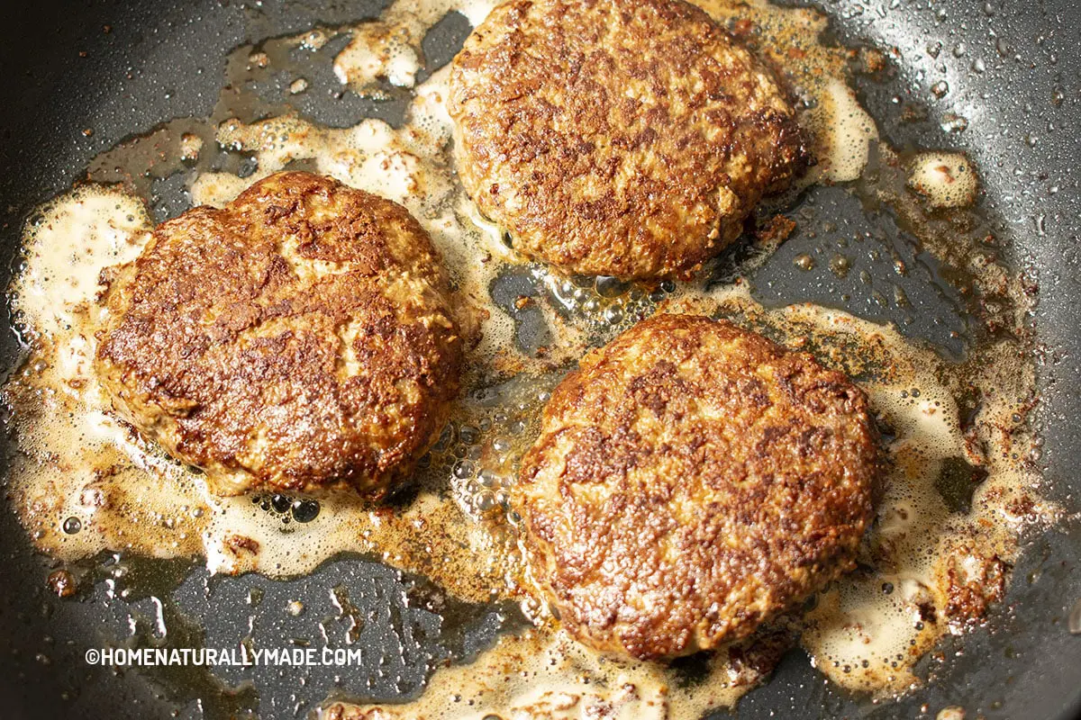 cooking burger patty in the pan