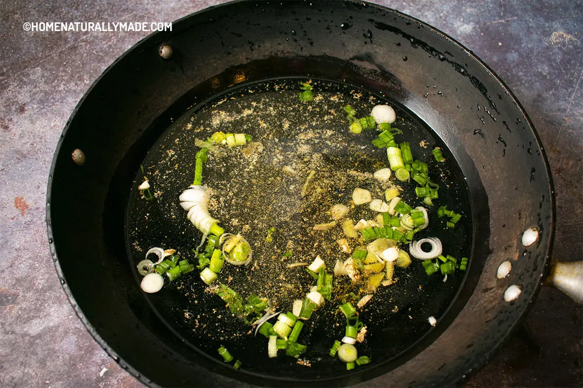 Water and seasonings in the wok