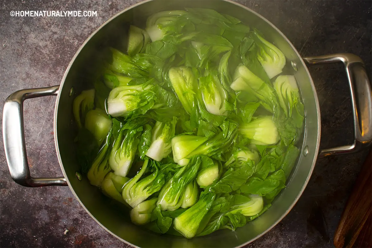 Blanch baby bok choy in the stockpot