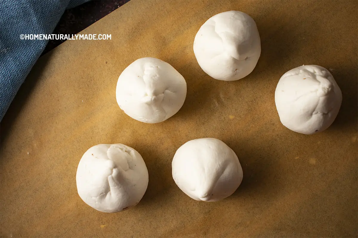 Freshly Wrapped Tang Yuan {Sweet Rice Flour Dumplings} on a parchment paper