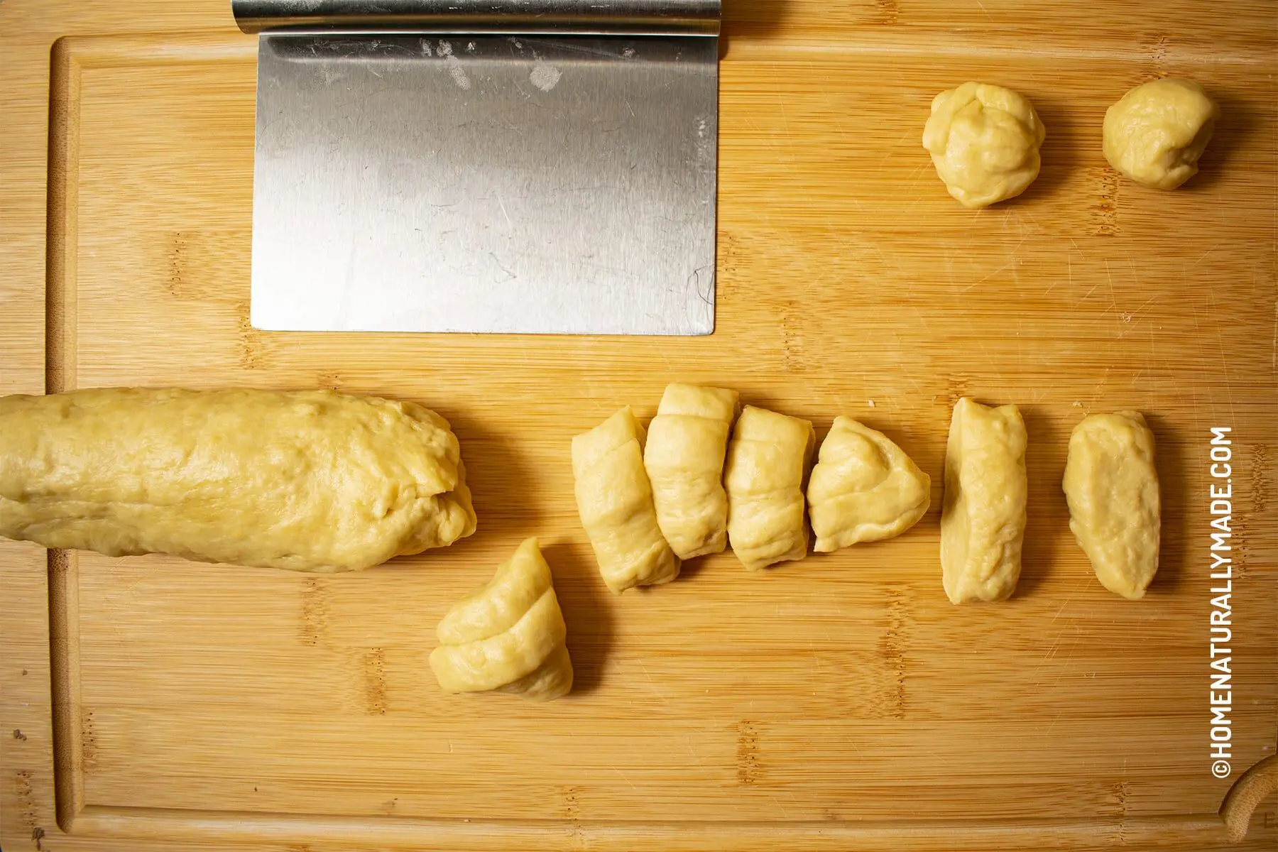 Divide water-based dough into equal portions for flaky pastry wrappers