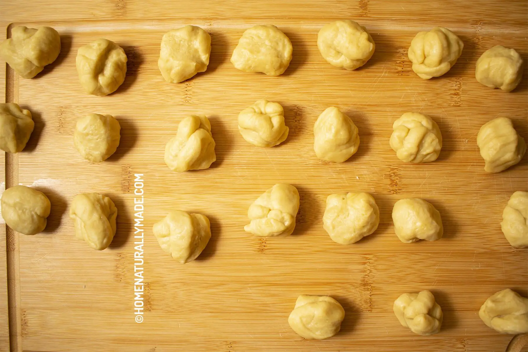 Divide water-based dough into equal portions for flaky pastry wrappers