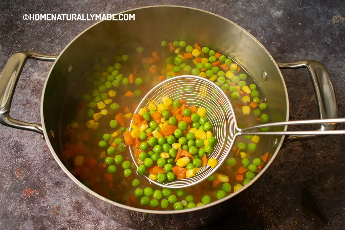 blanching peas, corns and chopped carrots