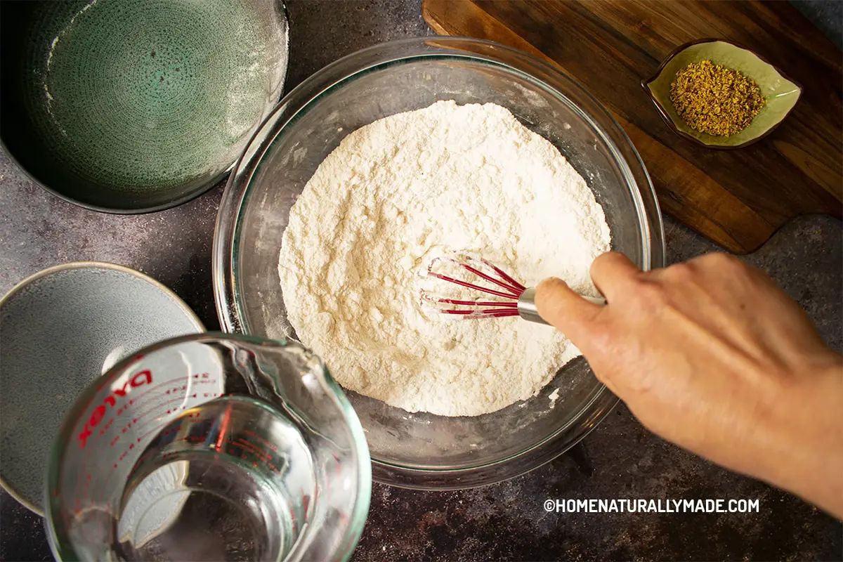 Whisk tiny water with rice flour at a time until they are satured