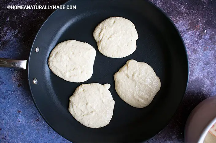 making coconut flour pancakes in the fry pan