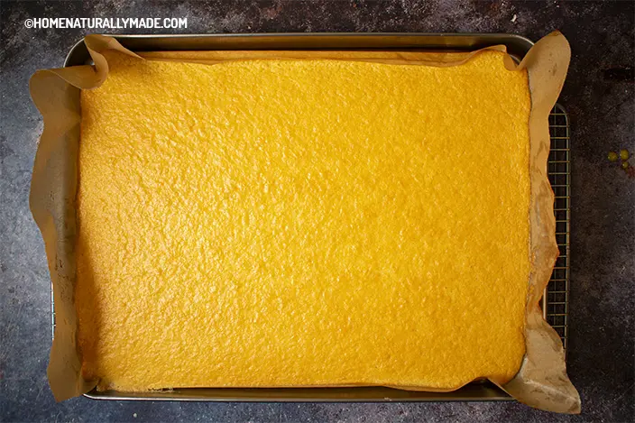 freshly bakeed sponge cake in the baking pan for cake roll