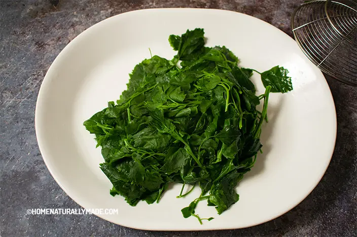Briefly blanched white goosefoot on a plate