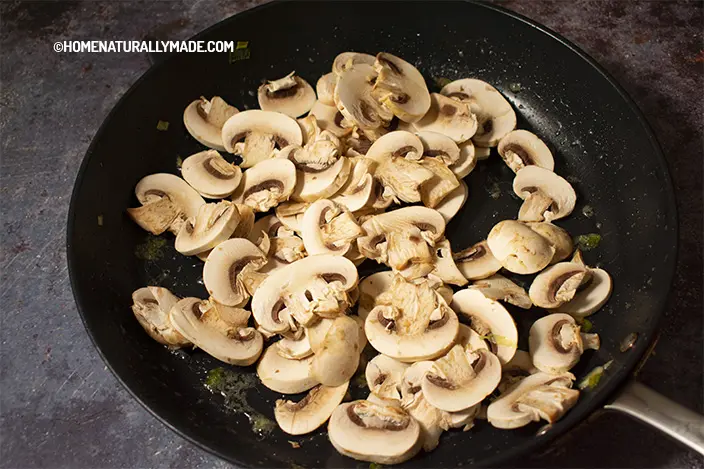 stir fry mushroom slices in the fry pan