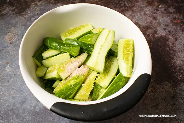 cucumber cut into finger-long strips and marinated with salt in a large mixing bowl