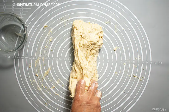 slap the dough against hard surface to stretch the dough