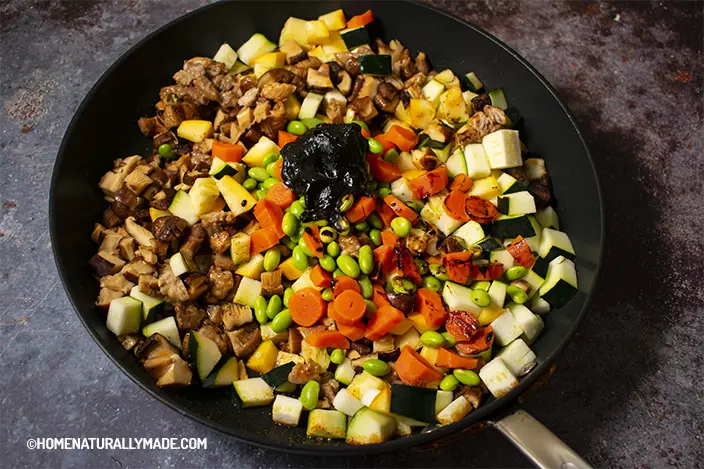 vegetable assortment cubes in the frying pan with soybean paste