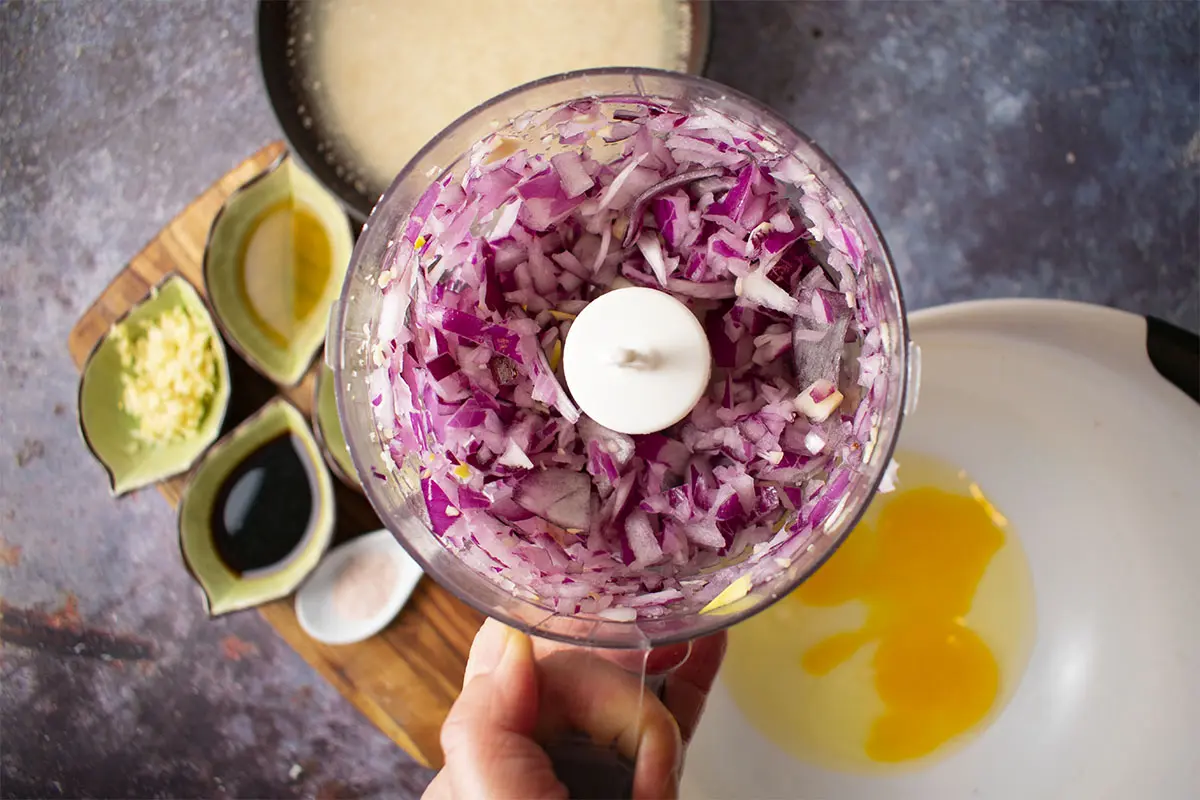 chopped red onion in compact food processor