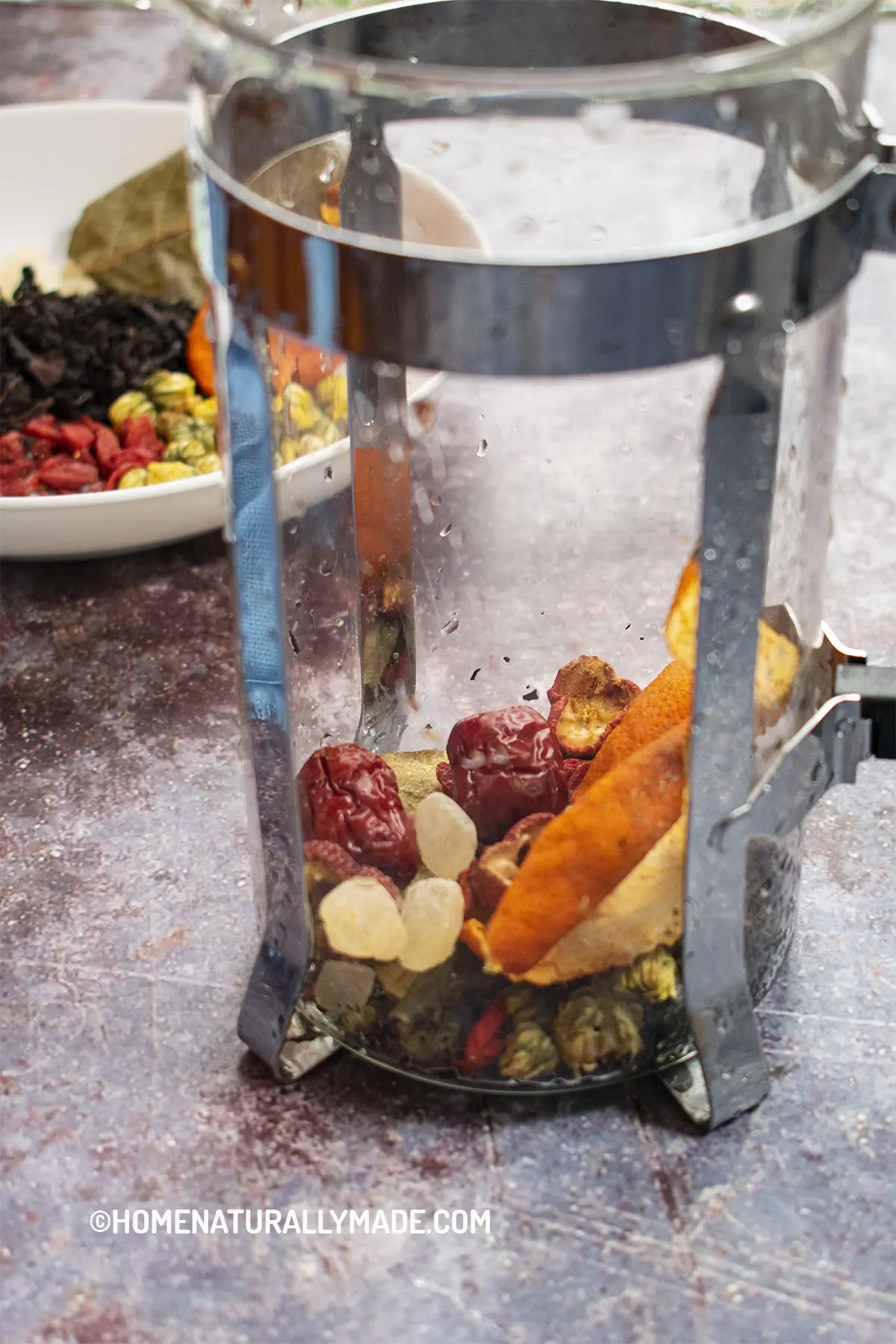 eight treasures tea ingredients in a French Press