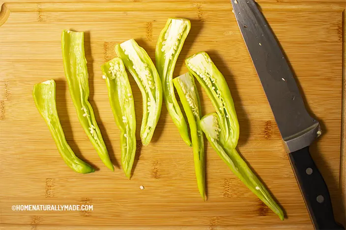 remove seeds of the long green peppers