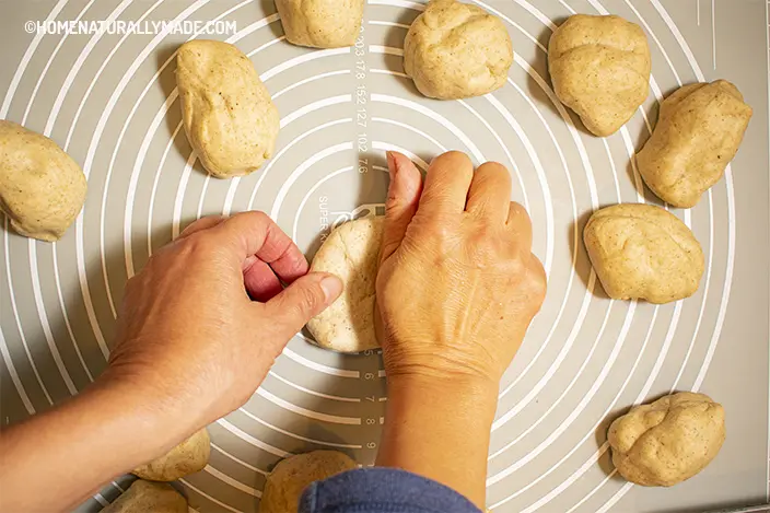 knead each portion of the bun dough toward center