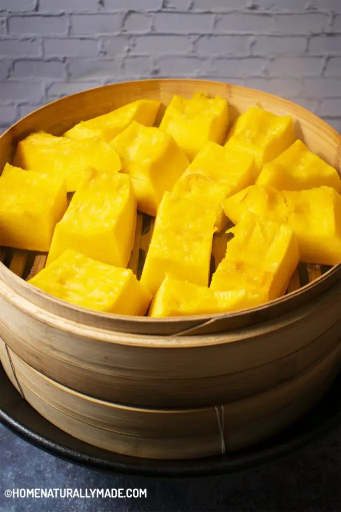 steaming pumpkin in bamboo steamer plus cast iron wok set