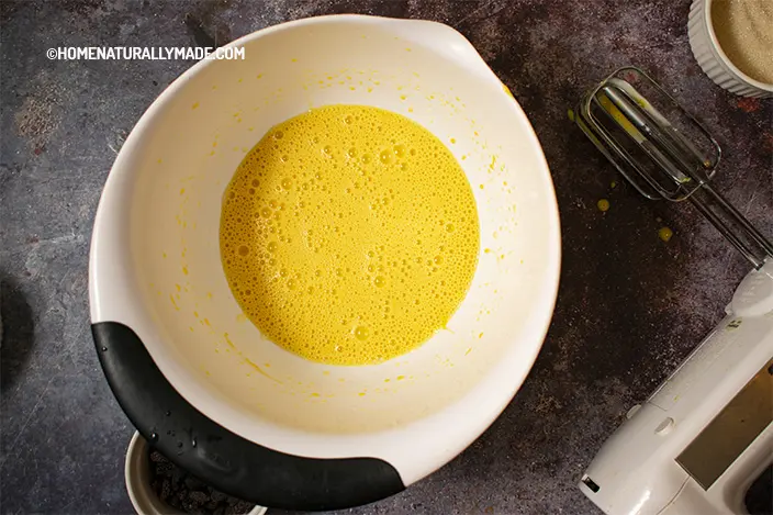 whisk egg yolks with milk and avocado oil