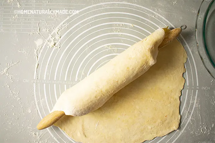 use a rolling pin to help transfer the pie crust dough sheet
