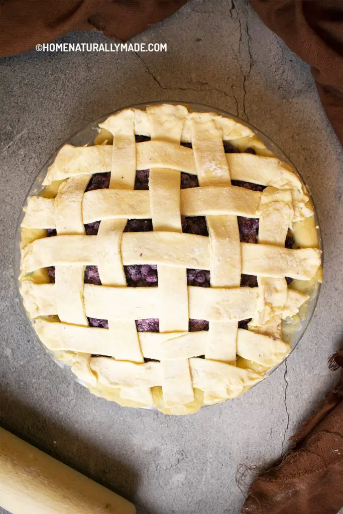 freshly made blueberry pie using homemade pie crust