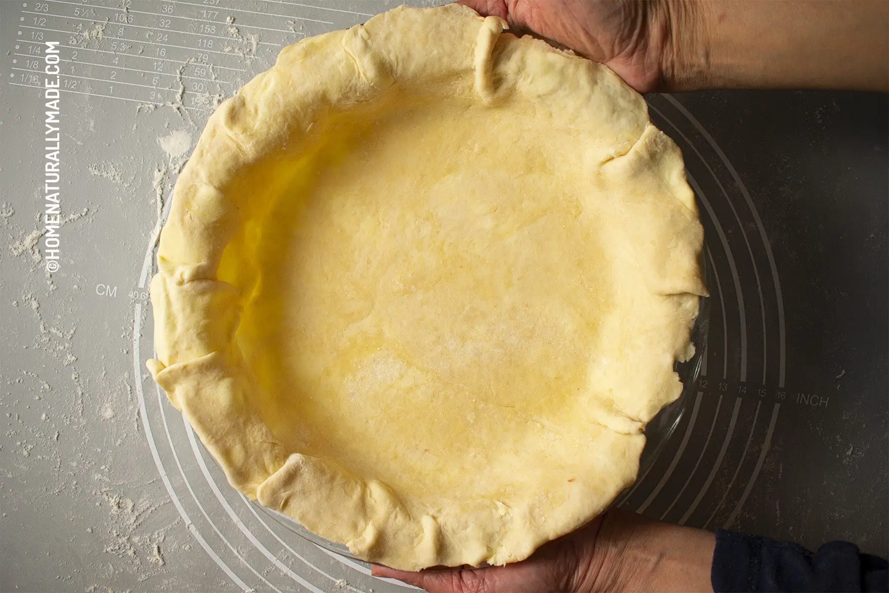 pie crust dough bottom in the pie baking dish