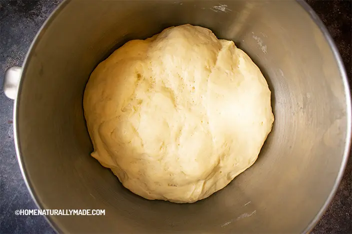 fully proofed half water half milk yeast dough in the mixer