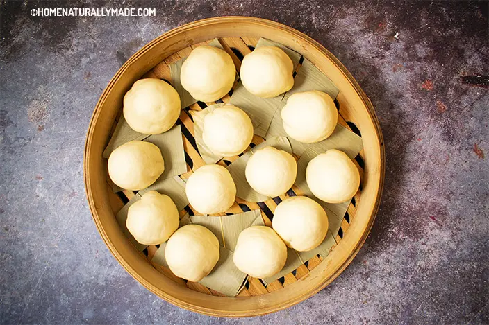 freshly wrapped red bean buns {Dou Sha Bao} in the bamboo steamer