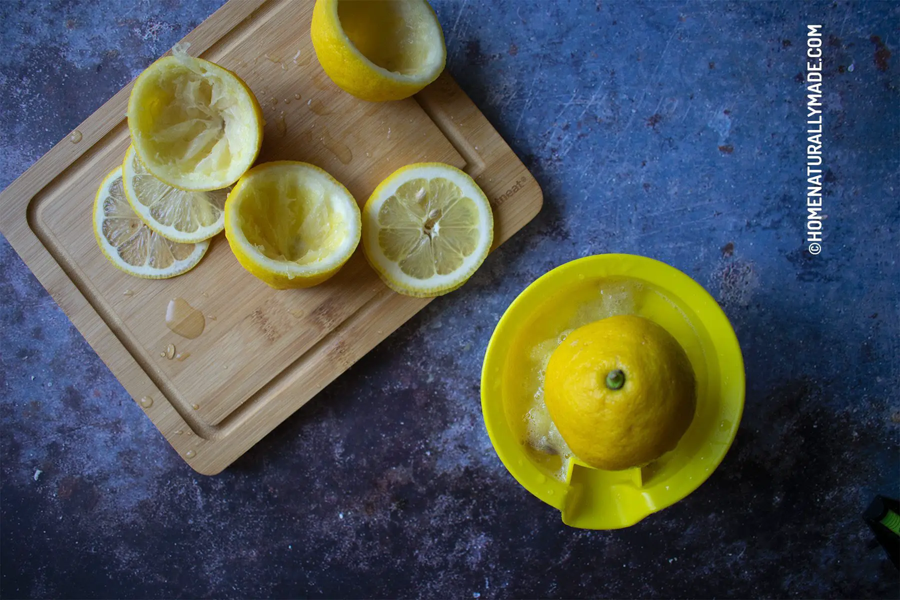 squeeze lemon juice using a hand juicer