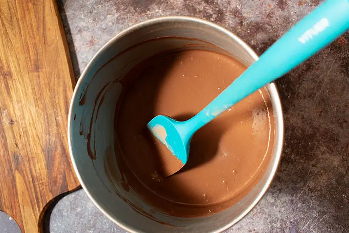 combine double-sifted cacao powder with milk